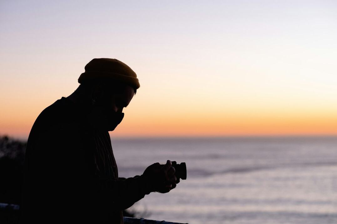 person journaling at sunrise